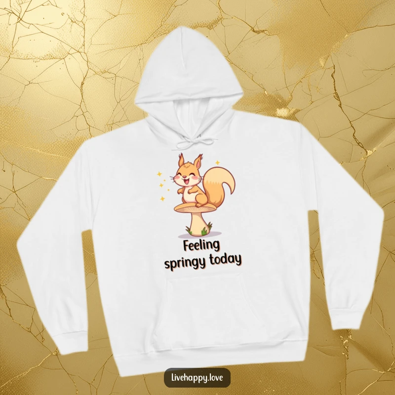 Funny hoodie depicting a happy squirrel grinning while bouncing high on a springy mushroom, leaving behind a shower of bright sparkles.